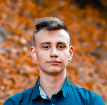 Man in blue shirt outdoors